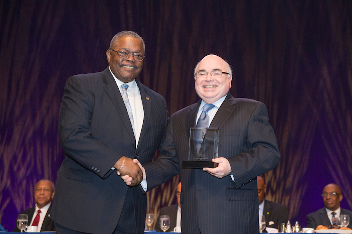 Stephen Cox accepting award